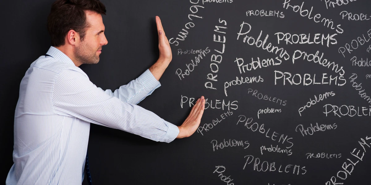 businessman pushing away problems