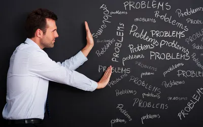 businessman pushing away problems