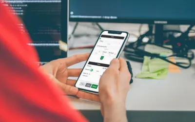 person-handling-a-quickadmin-software-progressive-web-application-in--mobile